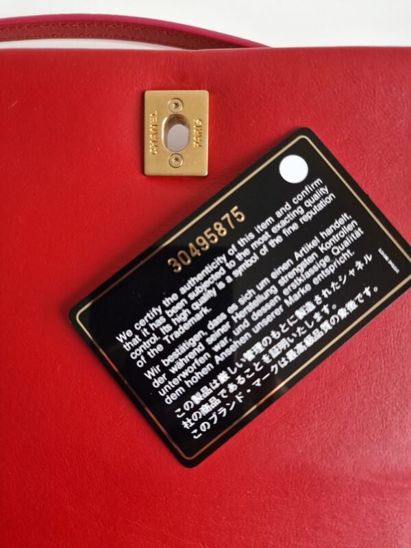 Chanel nailed flap bag in red calfskin GHW card