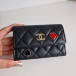 Chanel 23C black caviar leather poker charm flap card holder front 2