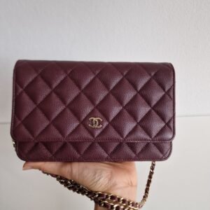 Chanel WOC dark red in hand